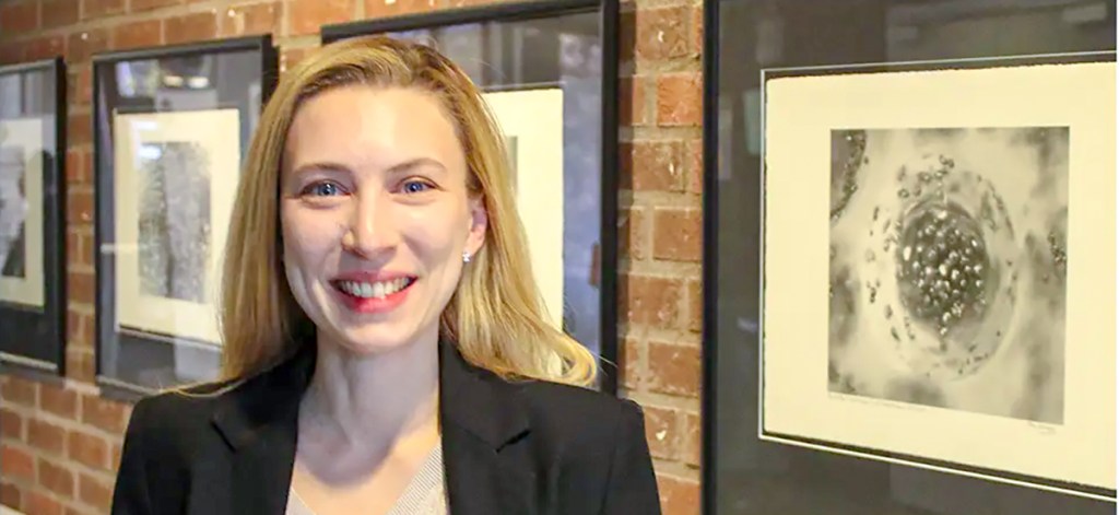 Anne-Cécile Potmans wears a black blazer and smiles at the camera.