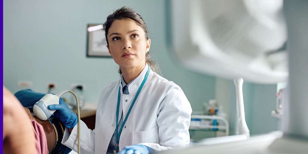 A woman uses a medical device.