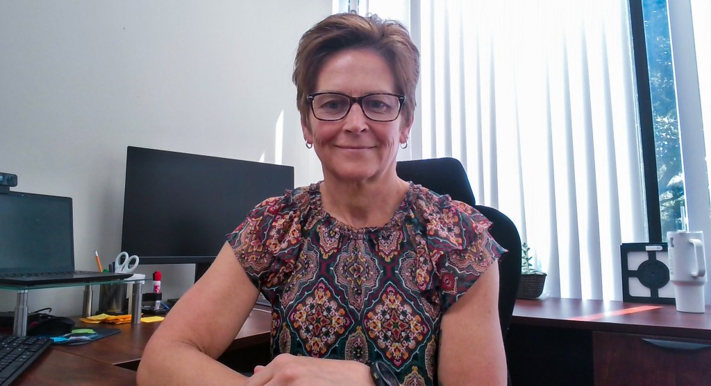 headshot of Jessica Fletcher sitting in her office